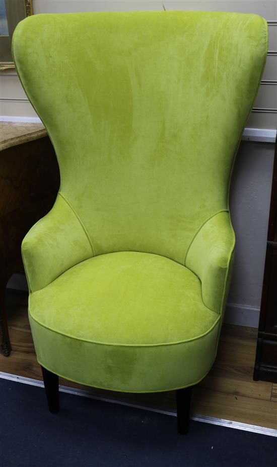 A pair of modern lime velvet high back armchairs